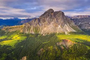 Aerial view of Sass De Putia (Peitlerkofel) and canyon surrounded by woods