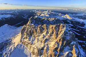 Aerial view of Sassolungo Sassopiatto and Grohmann peaks at sunset, Sella Group, Dolomites