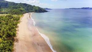 Aerials Prints: Aerial view of a serene beach with a lush green backdrop in the Philippines