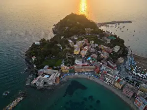 Liguria Prints: Aerial view of Sestri Levante and its Baia del Silenzio at sunset