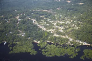 Manaus Prints: Aerial view of settlement in Amazon rainforest along the Rio Negro