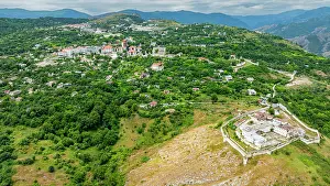 Settlement Prints: Aerial view showcases Shusha in Qarabaqh with green landscapes and buildings in Azerbaijan's mountainous region