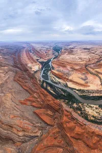 Large Prints: Aerial view showcasing a vibrant San Juan canyon with a winding river flowing through it