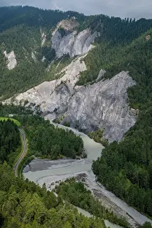 Gorge Prints: Aerial view showing the Rhein gorge with steep cliffs and river winding through the green forest in Switzerland