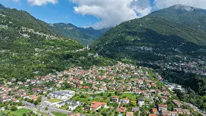 Bright Prints: Aerial view shows Enno surrounded by mountains and houses in Lake Como