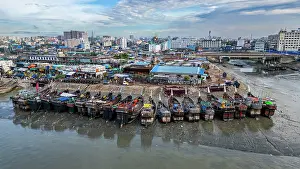 Fishermen Prints: Aerial view shows fish market and boats in Chittagong, Bangladesh during daytime