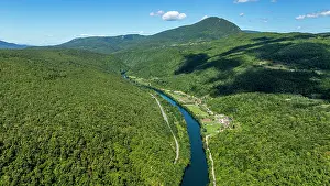 National Prints: Aerial view shows the Una river winding through forests in national park in Bosnia and Herzegovina