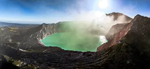 Crater Prints: Aerial view of smoke above the turquoise lake on crater of Kawah Ijen volcano