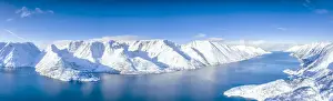 Fjord Prints: Aerial view of snow capped mountains and fjord during the cold arctic winter, Oksfjord