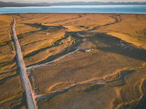 Pastoral Prints: An aerial view of the Song Kol lake area at sunrise, Kyrgyzstan