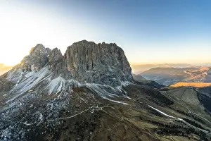 Mountain Pass Prints: Aerial view of sunset on Sassolungo, Sassopiatto and Passo Gardena in autumn, Dolomites