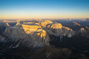 Fassa Valley Prints: Aerial view of sunset over Sella Group and Sass Pordoi in autumn, Val Gardena