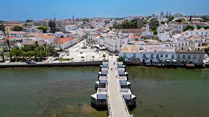 Streets Prints: Aerial view of Tavira showcasing the historic buildings and waterfront structures in Portugal