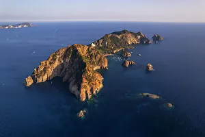 Latina Province Prints: Aerial view of the tiny island of Palmarola at sunset