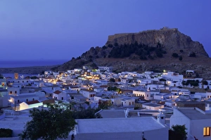 Aerial view over the town and acropolis of Lindos Town at dusk
