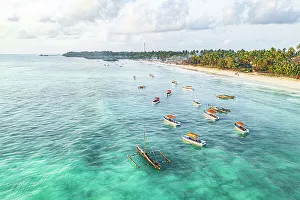 Zanzibar Prints: Aerial view of traditional dhow boats in the crystal sea