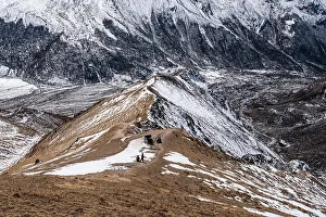 Fitness Prints: Aerial view of trekkers climbing narrow ridge trail toward Kyanjin Ri summit