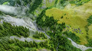 National Prints: Aerial view of the Tschinglengorge in Sardona National Park capturing steep cliffs and green fields in Switzerland