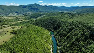 Fresh Prints: Aerial view of the Una river flowing through lush landscapes of Una National Park in Bosnia and Herzegovina