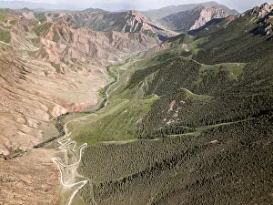 Outdoor Exploration Prints: Aerial view of a winding mountain road curves