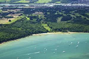 Images Dated 8th August 2011: Aerial view of yachts racing in Cowes Week on the Solent, with Osborne House in background