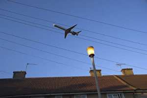Greater London Prints: Aeroplane above houses, Hounslow, Greater London, England, United Kingdom, Europe