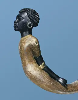 Egyptian Prints: An African adversary carved on the lower end of a ceremonial cane