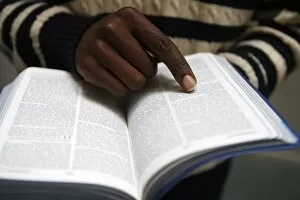 Images Dated 23rd November 2009: African man reading the Bible in a church, Paris, France, Europe
