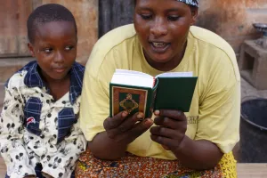 One Parent Prints: African mother reading the Koran, Lome, Togo, West Africa, Africa