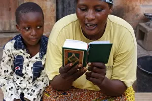 Images Dated 1st July 2010: African mother reading the Koran, Lome, Togo, West Africa, Africa