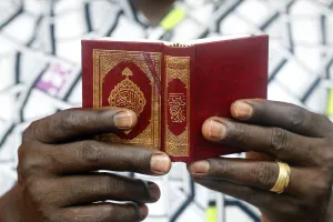 Mature Man Prints: African Muslim man reading the Quran, Lome, Togo, West Africa, Africa