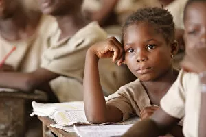 Looking Away Gallery: African primary school, young girl in the class room, Lome, Togo, West Africa, Africa
