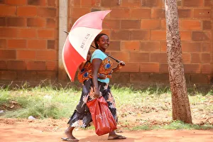 Carrying Prints: African woman carrying her baby on her back, Lome, Togo, West Africa, Africa