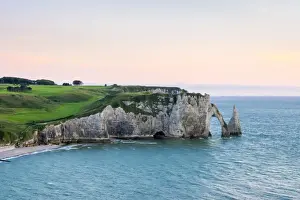 Etretat Prints: Aiguille d Etretat, stone arch on the coast of the English Channel at sunset, Etretat