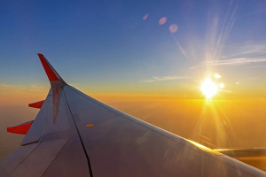 Passenger Prints: Aircraft plane wing, sunburst, sunset over England, United Kingdom