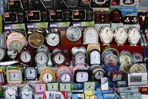 Alarm clocks of all different designs on market stall, Aluthgama, Sri Lanka, Asia