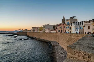 Facades Prints: Alghero city wall and historic buildings at sunset