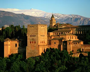 The Alhambra Palace, UNESCO World Heritage Site, with the snow covered Sierra Nevada mountains in the background The Alhambra Palace, UNESCO World Heritage Site, with the snow covered Sierra Nevada mountains in the background
