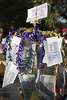 Money Prints: Alms on table to be distributed to monks, Ananda festival, Ananda Pahto