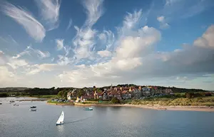 Alnmouth village and the Aln Estuary viewed from Church Hill on a calm late summers evening with a dramatic sky overhead, Alnmouth, near Alnwick, Northumberland, England, United