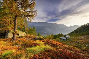 Autumnal Prints: Alpine bivouac at Lagazzuolo lake at sunrise during autumn