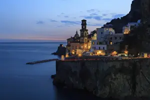 Campania Prints: Amalfi coast road light trails from cars with Church of Santa Maria Maddalena at blue hour