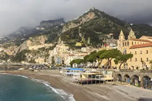 Amalfi waterfront in spring sun, with mist shrouded mountains, Amalfi Coast, UNESCO