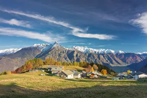 Valchiavenna Prints: Amazing clouds above a traditional mountain village, Valchiavenna, Lombardy, Italy
