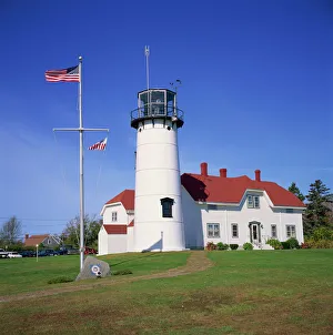 Light House Prints: The American flag flying beside the Chatham lighthouse at Cape Cod