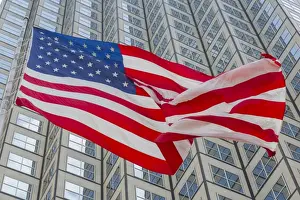Patriotism Prints: American flag set against skyscraper building windows in Downtown Miami, Miami, Florida
