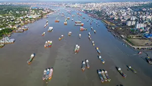 Fishermen Prints: Anchoring boats gather on the Karnaphuli River near the fish market in Chittagong