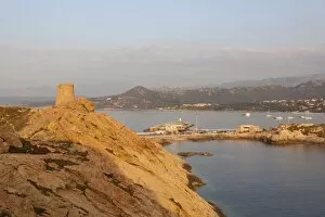 Images Dated 9th July 2010: The ancient Genoese tower overlooking the blue sea surrounding the village of Ile Rousse