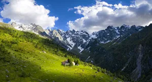 Ancient group of huts illuminated by sun, Val d Arigna, Valtellina, Orobie Alps