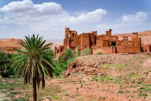 Atlas Mountains Prints: Ancient kasbah surrounded by palm trees